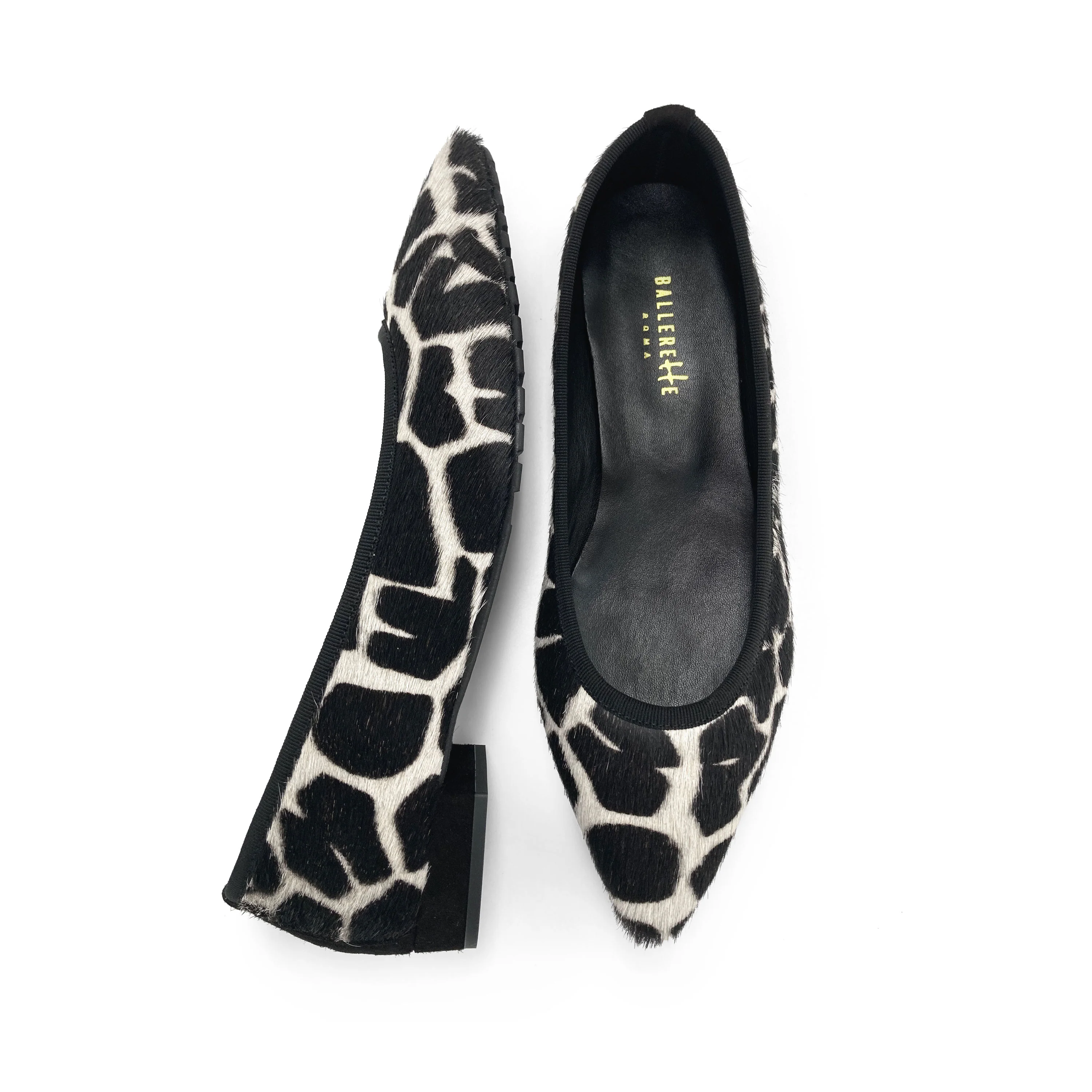 Black and white animal print pointed ballet flats